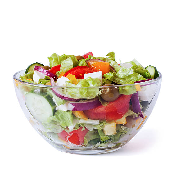 istock Greek Salad closeup isolated on white 539118436