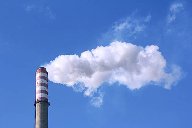 istock Smoke clouds from a high concrete chimney 539120467