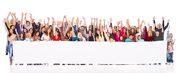 istock Crowd of cheerful people holding banner. 539120587