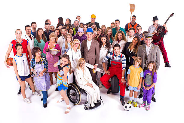 High angle view of large group of people with different occupation standing together and looking at the camera.
