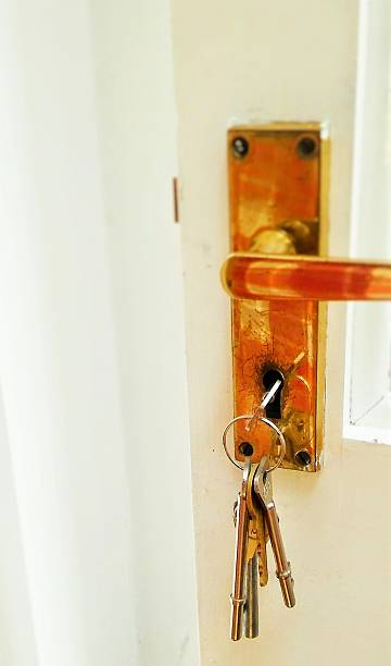 istock Metal key hanging in door lock 539120922