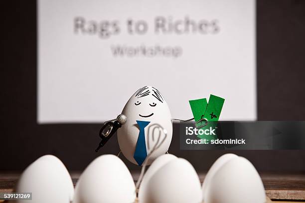 Business Egg Giving Seminar On Making Money Stock Photo - Download Image Now - Egg - Food, Currency, Education