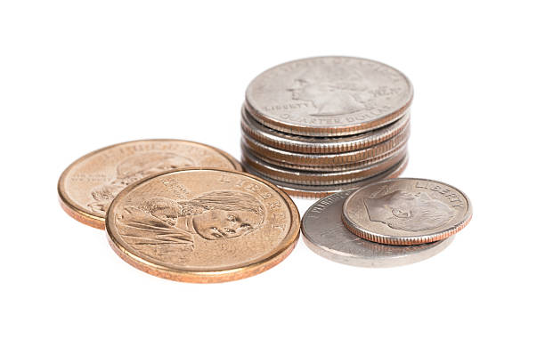 istock Pile of US coins isolated on white background 539121475