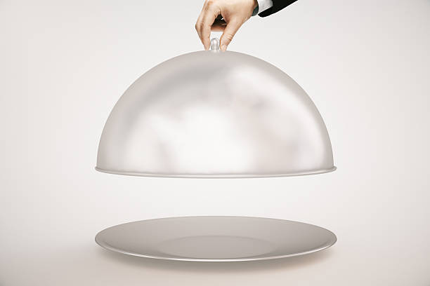 istock Hand opening cloche light background 539122288