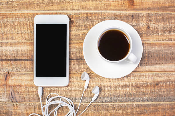 istock Coffee and cellphone with headphones 539123520
