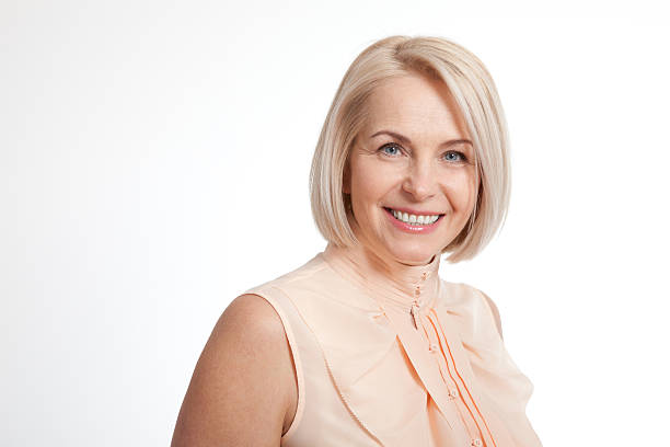 istock Friendly smiling middle-aged business woman isolated on white ba 539124022