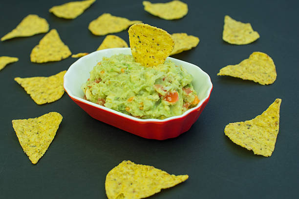 istock Guacamole And Nachos Side View On Black Background 539124782