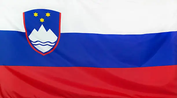 Photo of Slovenia Flag real fabric seamless close up