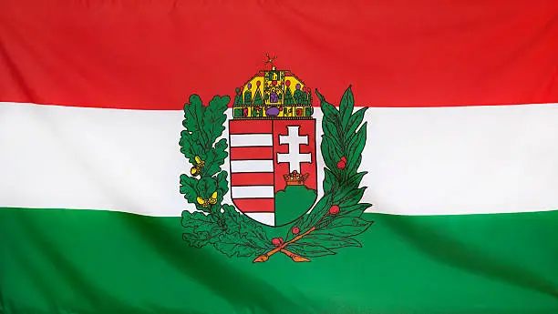 Photo of Hungary Coat of Arms Flag real fabric seamless close up