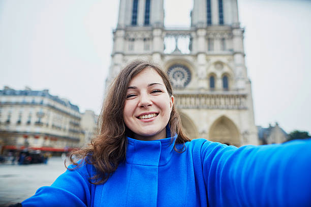 istock Beautiful young tourist in Paris, making funny selfie 539126780