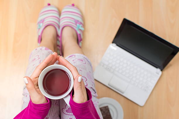 Woman having a cup of tea first person