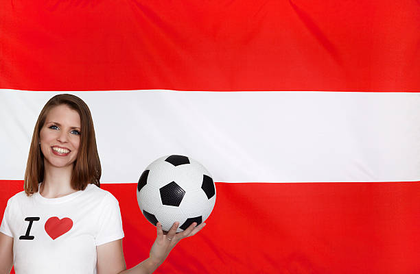istock Austria Flag with female soccer fan 539129000