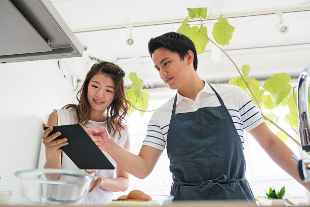 istock Young couple cooking together 539129574