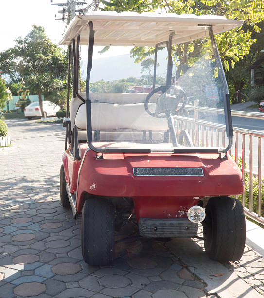 istock old Golf Buggy with palm tree backgroudn near empty 539129606