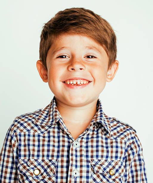 istock little cute boy on white background gesture smiling close up 539130094