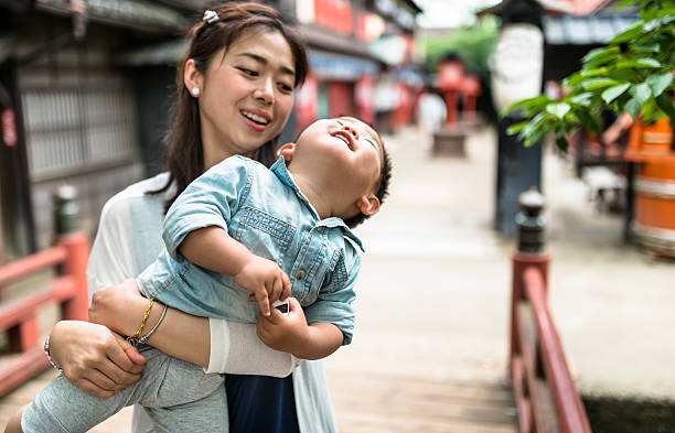 istock happiness young mother with his son have fun 539130942