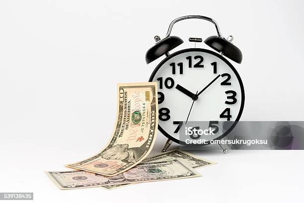 Black Table Clock With Us Dollar On White Background Stock Photo - Download Image Now