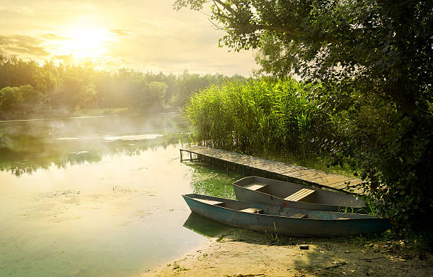 Boats near pier at beautiful summer morning