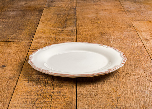 Porcelain Plate on the wood background