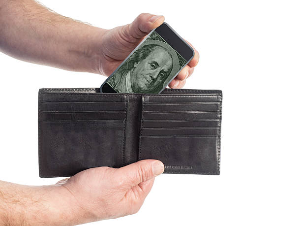 Smart Phone Pulled From Wallet Displays Benjamin Franklin On Screen stock photo