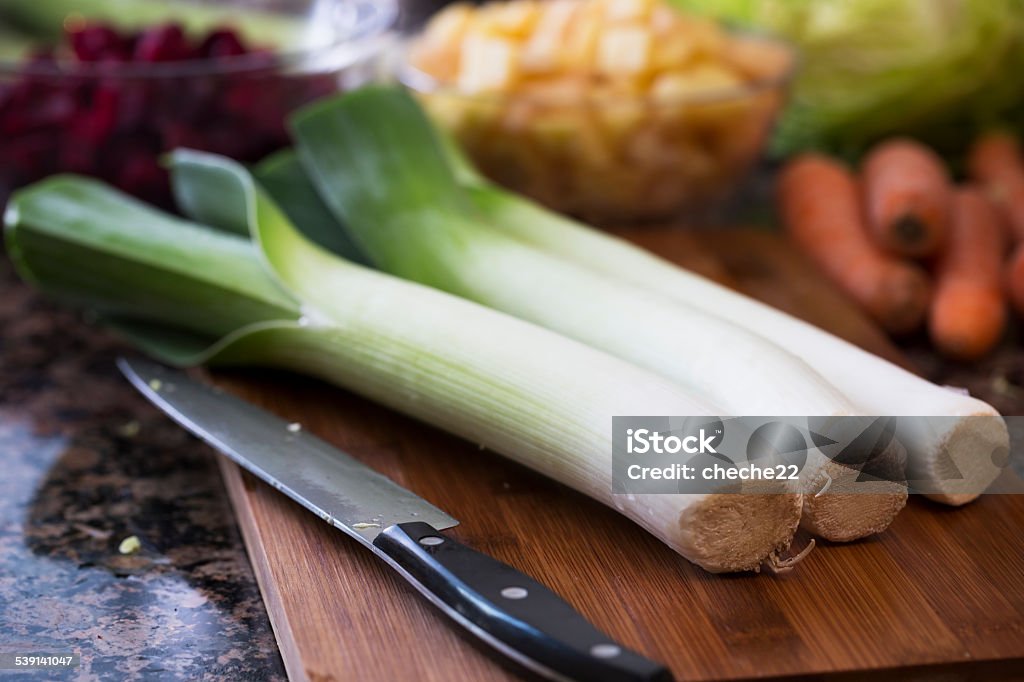 Leeks Leeks on cutting board with knife 2015 Stock Photo