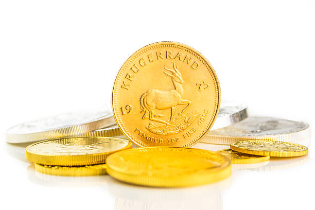 golden krugerrand standing on edge golden krugerrand standing on edge ounce stock pictures, royalty-free photos & images