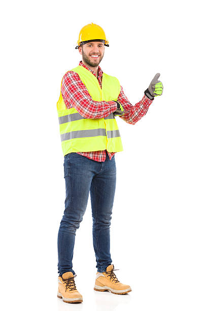 istock Man in reflective vest and hardhat showing thumb up 539141605