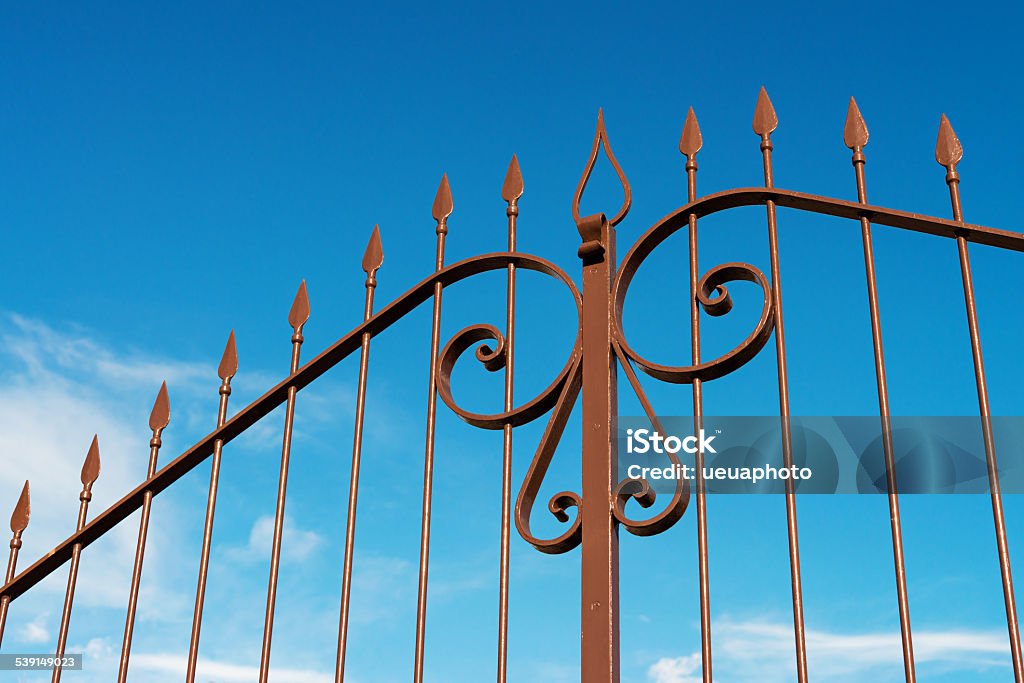 iron gate decorative steel gate against blue sky Gate Stock Photo