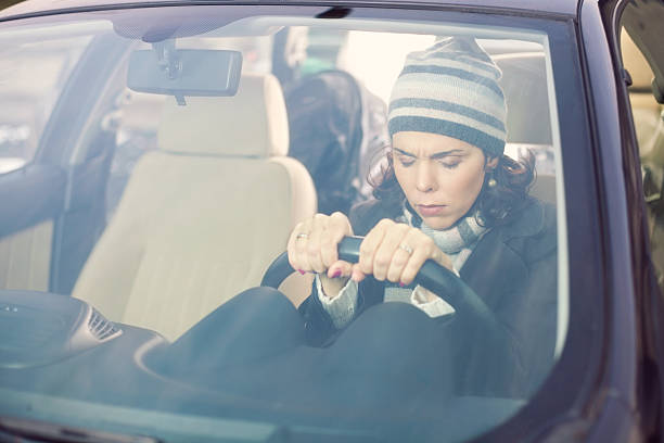 istock Sad Woman Behind the Steering Wheel 539149609