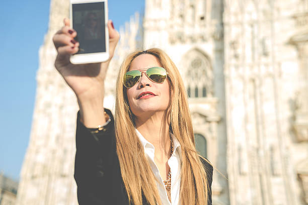 istock Woman Using Smartphone - Duomo, Milan, Italy 539149755