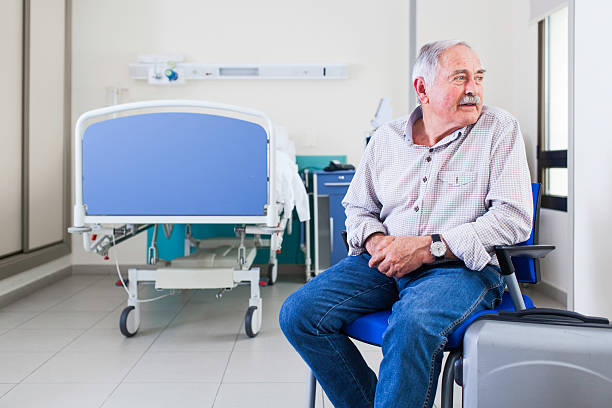 Patient about to leave hospital. Senior patient ready to go after a stay in hospital. More files of this series on port. demobilization photos stock pictures, royalty-free photos & images