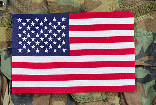 istock United States flag with military background 539151461