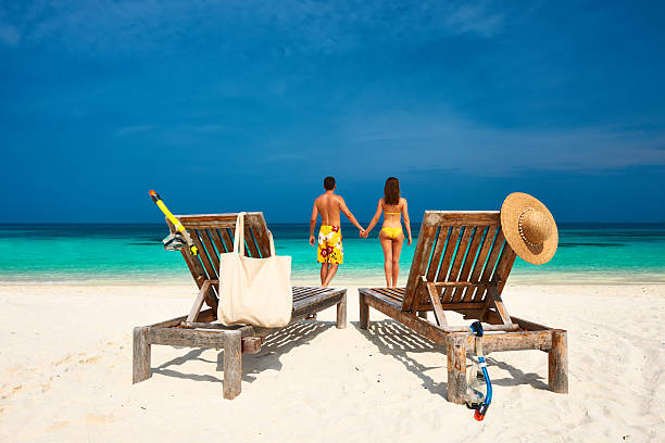 istock Couple in yellow on a beach at Maldives 539164561