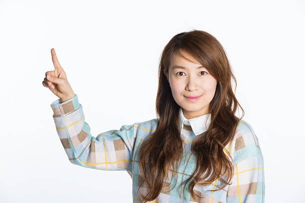 istock Young Asian girl standing on a white background 539164593