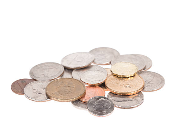 istock Pile of US coins isolated on white background 539165761