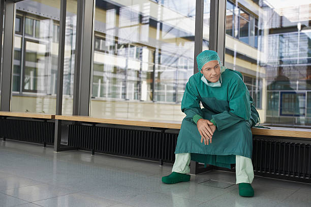 istock Pensive Physician Sitting In Hospital Corridor 539166095