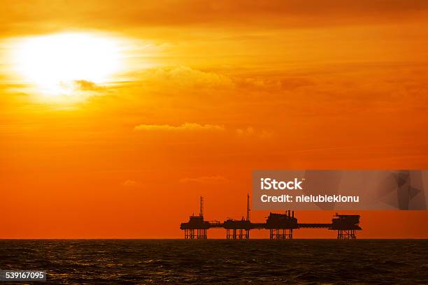 Oil Platform On The North Sea At Sunset Stock Photo - Download Image Now - 2015, Blue, Construction Platform