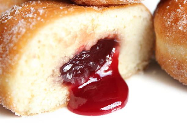 istock Image of fresh jam doughnuts / jelly donuts, with caster sugar 539167493