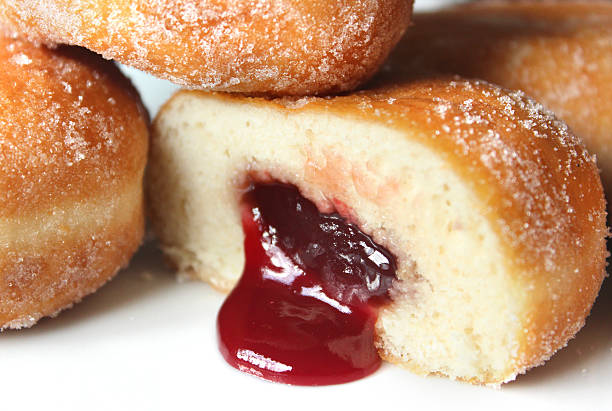 istock Image of fresh jam doughnuts / jelly donuts, with caster sugar 539167515