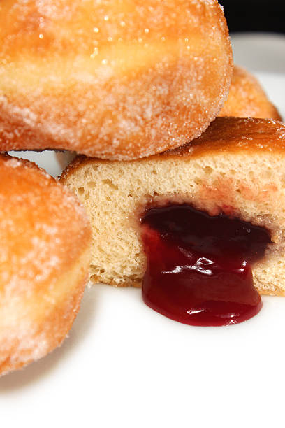 istock Image of fresh jam doughnuts / jelly donuts, with caster sugar 539167543