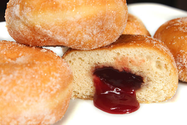 istock Image of fresh jam doughnuts / jelly donuts, with caster sugar 539167545