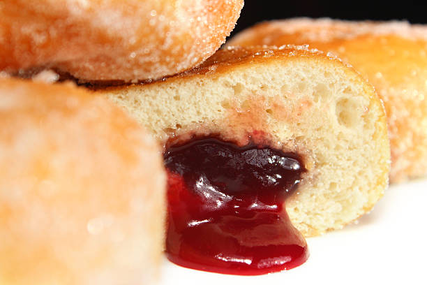 istock Image of fresh jam doughnuts / jelly donuts, with caster sugar 539167547
