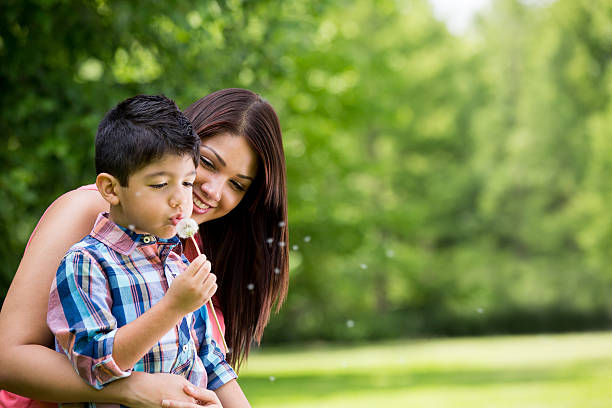 istock Mother and son with dandelion 539167601