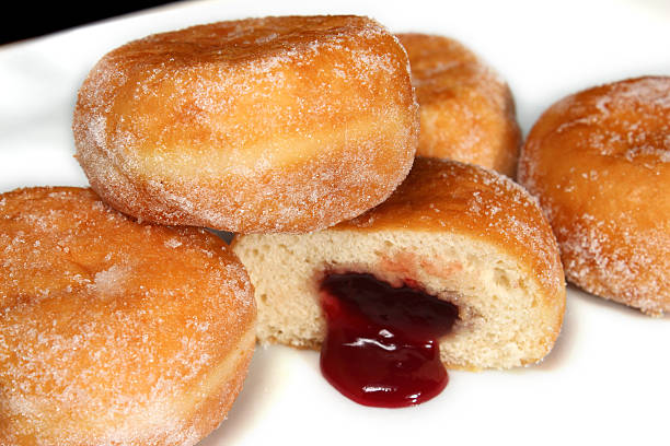 istock Image of fresh jam doughnuts / jelly donuts, with caster sugar 539167611