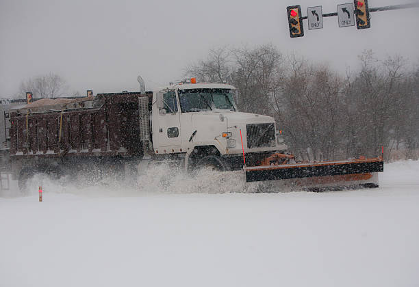istock Big snowplow truck plowing highway 539180459