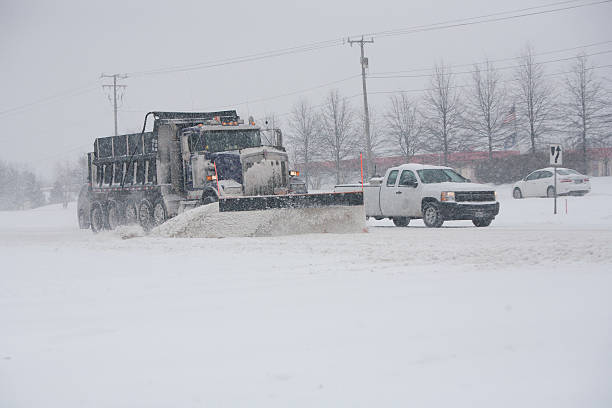 istock Big snowplow truck plowing highway 539180543