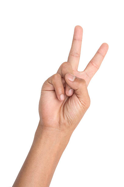 istock Hand forming victory sign isolated on white background 539181003