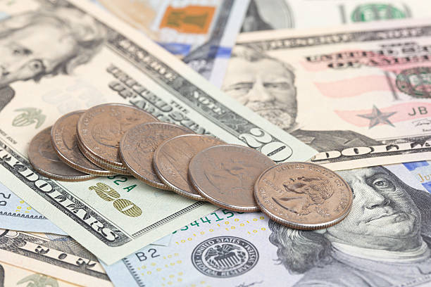 istock US coins on US banknotes close up 539182813