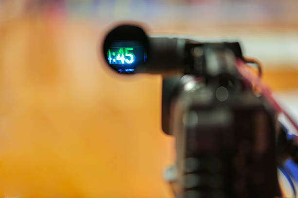Professional video camera recording the basketball game