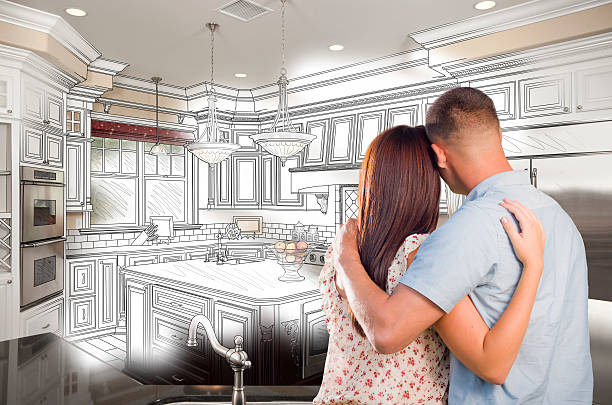 istock Young Military Couple Inside Custom Kitchen and Design Drawing C 539183279
